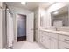 Bright, white bathroom with tile flooring, and double closets for ample storage space at 815 Marlowe Rd # 10, Raleigh, NC 27609