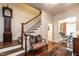 Inviting foyer with hardwood floors, staircase, and traditional decor, creating a warm welcome at 815 Marlowe Rd # 10, Raleigh, NC 27609