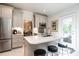 Bright kitchen with stainless steel appliances, a large island, and access to outdoor area, designed for modern living at 815 Marlowe Rd # 10, Raleigh, NC 27609