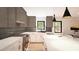 Bright kitchen featuring modern appliances, light stylish cabinets, a large island, and ample counter space at 1017 N Buchanan Blvd # C, Durham, NC 27701