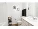 Bright, clean bathroom with a white vanity, neutral walls, and modern fixtures at 1025 Quindell Dr, Holly Springs, NC 27540