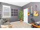 Stylish bedroom with modern decor, a comfortable couch, and lots of natural light at 1025 Quindell Dr, Holly Springs, NC 27540