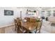 Open dining room view showcases stylish decor and seamless flow into the inviting living area at 1025 Quindell Dr, Holly Springs, NC 27540