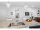 Kitchen island featuring stone countertops, sink and faucet at 1025 Quindell Dr, Holly Springs, NC 27540