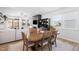 Spacious living area adjacent to the dining room, with a cozy fireplace and backyard views at 1025 Quindell Dr, Holly Springs, NC 27540