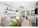 Comfortable living room with a sliding glass door to the screened-in porch and decorative shelving at 1025 Quindell Dr, Holly Springs, NC 27540