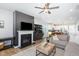 Open-concept living space with fireplace and kitchen access, perfect for entertaining and Gathering gatherings at 1025 Quindell Dr, Holly Springs, NC 27540