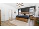 Spacious main bedroom with wood accents, a ceiling fan, and ensuite bathroom access at 1025 Quindell Dr, Holly Springs, NC 27540