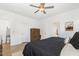 Bright main bedroom featuring a ceiling fan and ensuite bathroom, offering a comfortable retreat at 1025 Quindell Dr, Holly Springs, NC 27540