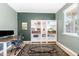 Stylish home office with a desk, chair, shelves and decorative rug at 1025 Quindell Dr, Holly Springs, NC 27540