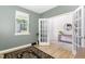 Modern office with French doors, wood floors and a view of backyard at 1025 Quindell Dr, Holly Springs, NC 27540