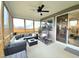 Screened-in porch features comfortable seating, string lights, and a relaxing hanging chair at 1025 Quindell Dr, Holly Springs, NC 27540