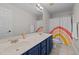 Bathroom with double sinks, a rainbow shower curtain, and vanity at 10513 Cardington Ln, Raleigh, NC 27614