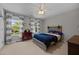 Bedroom featuring a wooden bed frame and lots of natural light at 10513 Cardington Ln, Raleigh, NC 27614