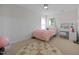 Bright bedroom with a stylish area rug and a dressing table at 10513 Cardington Ln, Raleigh, NC 27614