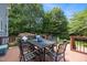Inviting deck area with outdoor dining furniture and ample space for entertaining overlooking the backyard at 10513 Cardington Ln, Raleigh, NC 27614