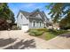 Charming two-story home featuring a driveway, two-car garage, and beautiful landscaping at 10513 Cardington Ln, Raleigh, NC 27614