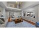 Spacious living room with a hardwood floor, open layout, and neutral color scheme at 10513 Cardington Ln, Raleigh, NC 27614
