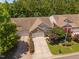 Beautiful aerial view of a brick home featuring an attached two-car garage and mature trees at 112 Sabiston Ct, Cary, NC 27519