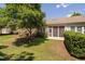 Secluded backyard featuring a well-maintained lawn, mature tree and screened-in porch at 112 Sabiston Ct, Cary, NC 27519