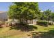 Secluded backyard featuring a well-maintained lawn and mature tree offering shade at 112 Sabiston Ct, Cary, NC 27519
