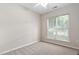 Neutral bedroom featuring plush carpeting and a large window that lets in ample natural light at 112 Sabiston Ct, Cary, NC 27519