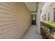 Covered entrance featuring neutral siding, leading to the front door of this inviting home at 112 Sabiston Ct, Cary, NC 27519