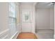 Inviting foyer with hardwood flooring and natural light streaming in at 112 Sabiston Ct, Cary, NC 27519