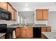 Updated kitchen featuring granite countertops, stainless steel sink and appliances at 112 Sabiston Ct, Cary, NC 27519