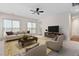 Living room with area rug, stylish furnishings and a ceiling fan at 112 Sabiston Ct, Cary, NC 27519