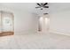 Open-concept living area boasts plush carpeting and easy access to entry and other living spaces at 112 Sabiston Ct, Cary, NC 27519