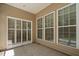 Covered patio featuring siding and large windows leading to an indoor space at 112 Sabiston Ct, Cary, NC 27519