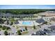 Community pool and clubhouse nestled among the townhouses at 1125 Russet Ln, Apex, NC 27523