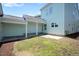 View of the backyard featuring a small patio area with grassy lawn at 1125 Russet Ln, Apex, NC 27523