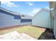 Side yard with stone pavers and green and blue siding; a perfect space for outdoor relaxation at 1125 Russet Ln, Apex, NC 27523