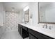 Bathroom with double vanity, dark wood cabinets, and a leaf-patterned shower curtain at 1125 Russet Ln, Apex, NC 27523