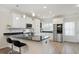 Bright kitchen boasts granite countertops, stainless steel appliances, and ample cabinet space at 1125 Russet Ln, Apex, NC 27523