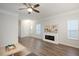 Spacious living room featuring a fireplace and abundant natural light, ideal for entertaining guests at 1125 Russet Ln, Apex, NC 27523