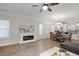 Bright living room with a cozy fireplace and views into the kitchen, perfect for Gathering gatherings at 1125 Russet Ln, Apex, NC 27523