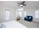 Bedroom with ceiling fan, sitting area, and plenty of natural light from multiple windows at 1125 Russet Ln, Apex, NC 27523