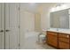 Bathroom with tile floors features a vanity with a wood cabinet and white countertop at 1148 Survada Ln, Morrisville, NC 27560
