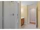 Bathroom featuring a glass-enclosed shower and vanity with wooden cabinets and tiled floor at 1148 Survada Ln, Morrisville, NC 27560