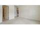 Minimalist bedroom with neutral carpet and paint tones, alongside the convenience of an ensuite bathroom at 1148 Survada Ln, Morrisville, NC 27560