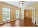 Bright bedroom with hardwood floors, neutral walls, and large windows for natural light at 1148 Survada Ln, Morrisville, NC 27560