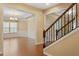 Dining area featuring hardwood floors, wainscoting, and an elegant chandelier creating a refined atmosphere at 1148 Survada Ln, Morrisville, NC 27560