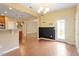 Hallway featuring hardwood floors and access to the stairs and kitchen at 1148 Survada Ln, Morrisville, NC 27560