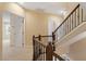 Hallway featuring a wood banister and rod iron spindles overlooking the staircase at 1148 Survada Ln, Morrisville, NC 27560