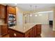 Kitchen featuring granite countertops, stainless steel appliances and wooden cabinetry at 1148 Survada Ln, Morrisville, NC 27560