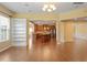 Spacious living room area featuring hardwood flooring and an open concept floor plan at 1148 Survada Ln, Morrisville, NC 27560