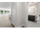 Bathroom view featuring a black vanity and a bathroom area offering functionality and style at 11548 Helmond Way # 104, Raleigh, NC 27617